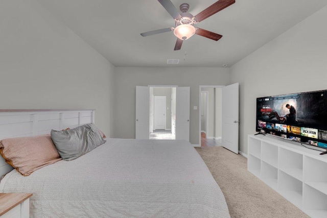 bedroom with baseboards, visible vents, ceiling fan, and carpet flooring