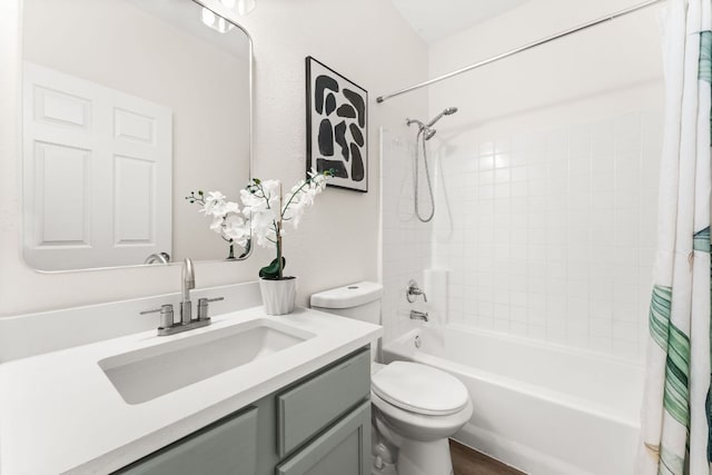 bathroom featuring toilet, wood finished floors, vanity, and shower / tub combo with curtain