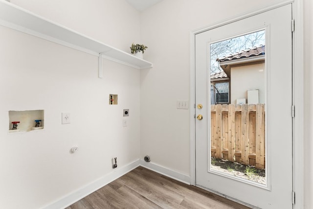 laundry room with washer hookup, electric dryer hookup, wood finished floors, laundry area, and baseboards