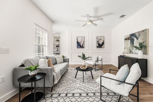 5604 Toscana Ave, Austin, TX 78724 - living room featuring a ceiling fan, wood finished floors, and baseboards