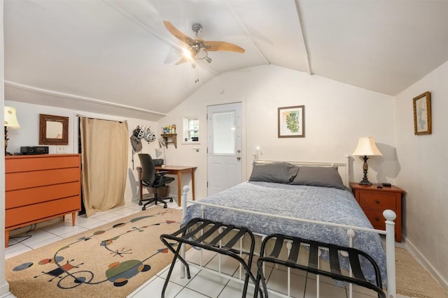 bedroom featuring baseboards, lofted ceiling, light tile patterned flooring, and a ceiling fan