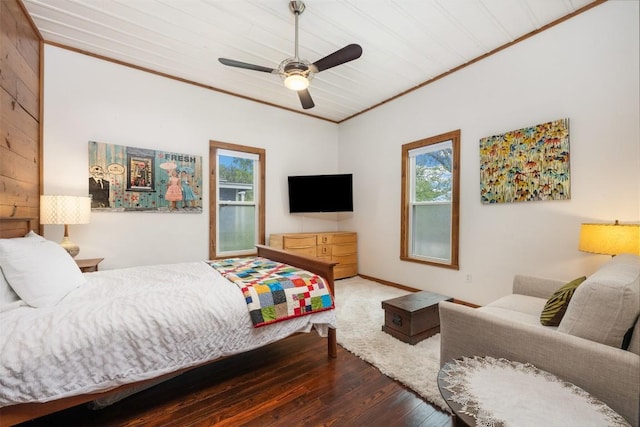 bedroom featuring ornamental molding, a ceiling fan, and wood finished floors