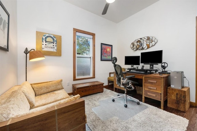 office space featuring ceiling fan, baseboards, and wood finished floors