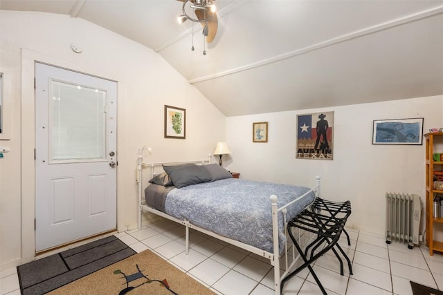 tiled bedroom with radiator and vaulted ceiling