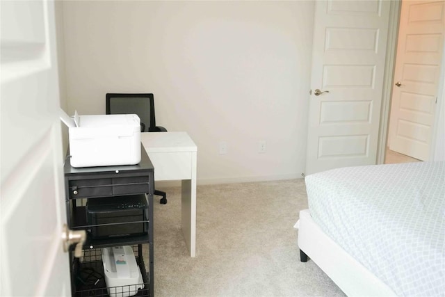 bedroom featuring carpet floors and baseboards