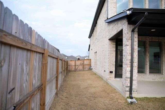 view of yard with a patio and fence