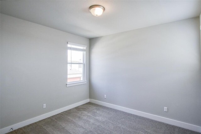 205 Pinnacle Ln, Kyle, TX 78640 - empty room with baseboards and carpet flooring