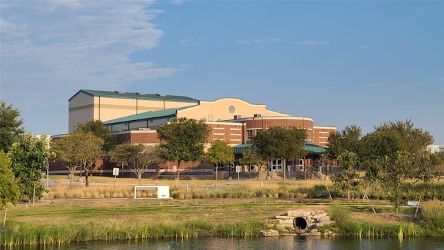 view of building exterior with a water view