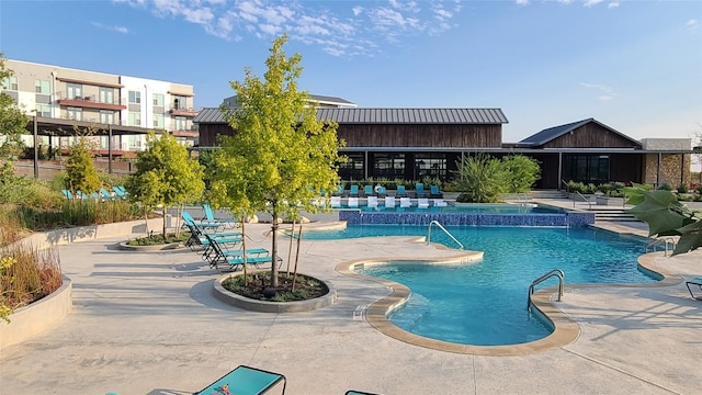 community pool featuring a patio area