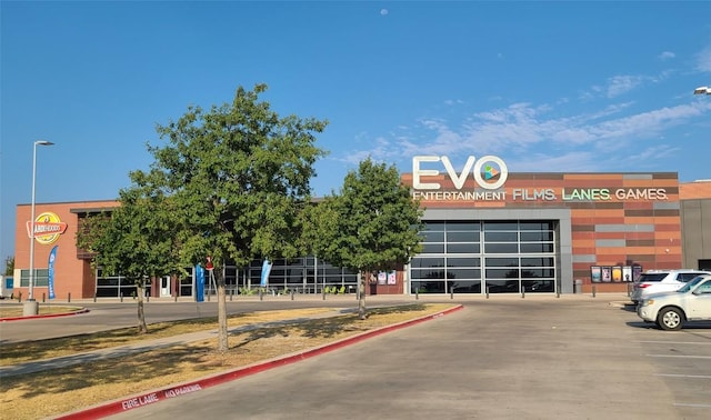 view of building exterior featuring uncovered parking