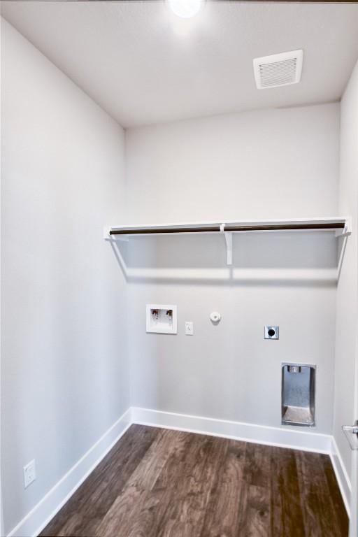217 Pinnacle Ln, Kyle, TX 78640 - washroom featuring electric dryer hookup, dark wood-style flooring, hookup for a gas dryer, hookup for a washing machine, and baseboards