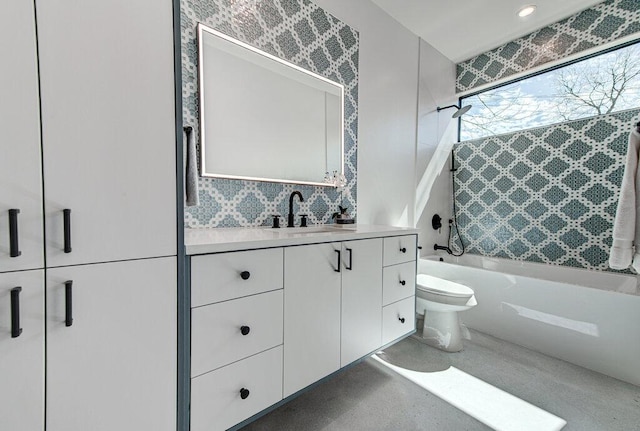 full bathroom featuring  shower combination, toilet, and vanity