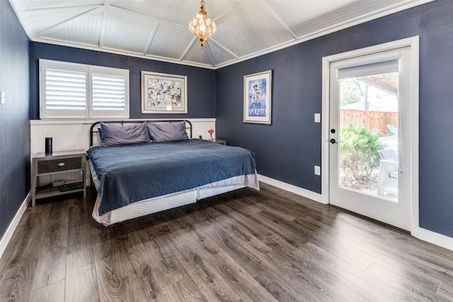 bedroom with access to outside, baseboards, and wood finished floors