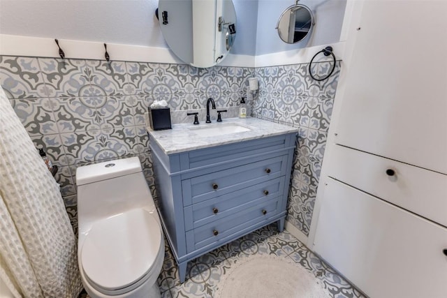 bathroom with toilet and vanity