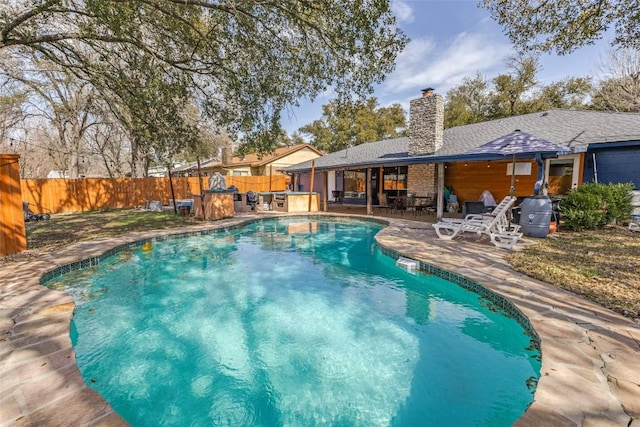 view of swimming pool with a patio, a fenced backyard, and a fenced in pool