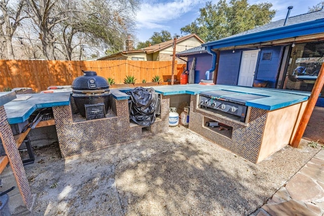 view of patio featuring fence