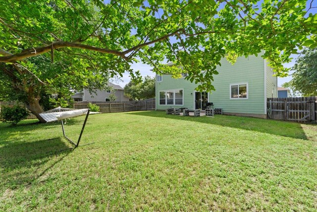 view of yard featuring a fenced backyard