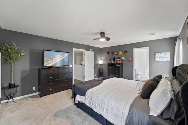 bedroom featuring light carpet, baseboards, visible vents, connected bathroom, and a ceiling fan