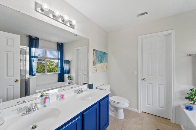 bathroom featuring tile patterned flooring, visible vents, a bathtub, and a sink