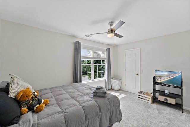 bedroom with light colored carpet, visible vents, ceiling fan, and baseboards