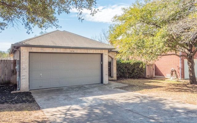 garage with fence