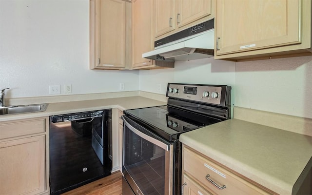 kitchen featuring electric range, dishwasher, light countertops, under cabinet range hood, and a sink