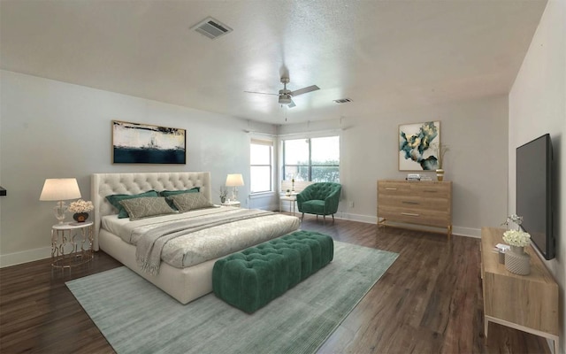 bedroom featuring wood finished floors, visible vents, and baseboards