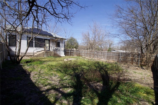 view of yard featuring a fenced backyard