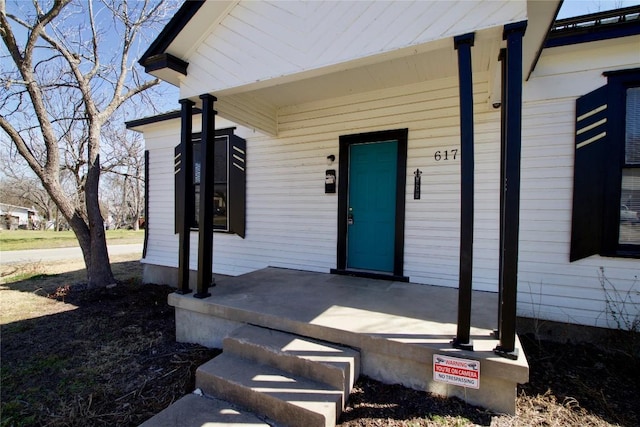 doorway to property featuring a porch