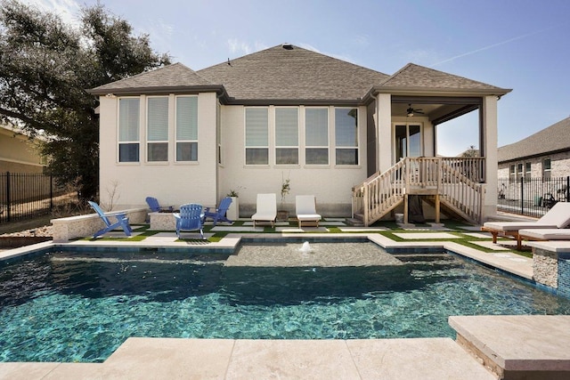 back of property featuring a patio, fence, and a fenced in pool