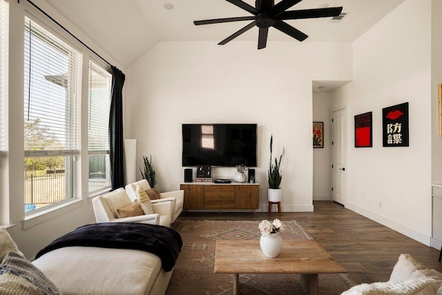 living room with lofted ceiling, ceiling fan, dark wood-type flooring, visible vents, and baseboards