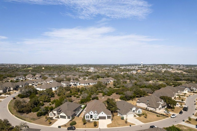 birds eye view of property with a residential view