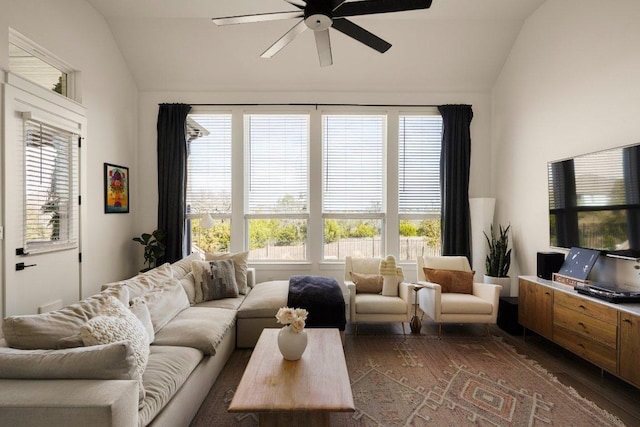 living area with lofted ceiling, a ceiling fan, and wood finished floors