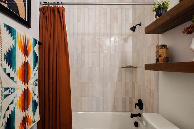 bathroom with shower / bath combo with shower curtain and toilet