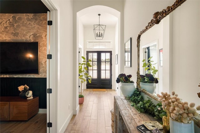 296 Running Bird Rd, Austin, TX 78737 - entryway with arched walkways, wood finished floors, baseboards, and plenty of natural light