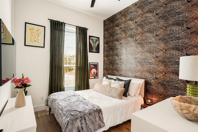 296 Running Bird Rd, Austin, TX 78737 - bedroom featuring wood finished floors and an accent wall