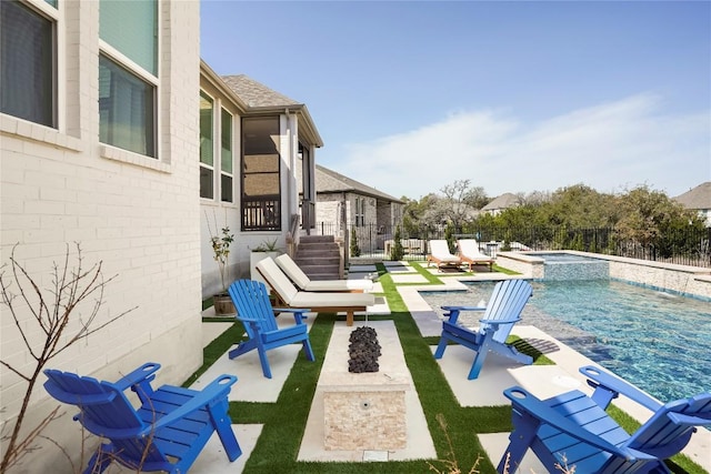 296 Running Bird Rd, Austin, TX 78737 - view of pool with an outdoor fire pit, a pool with connected hot tub, a fenced backyard, and a patio