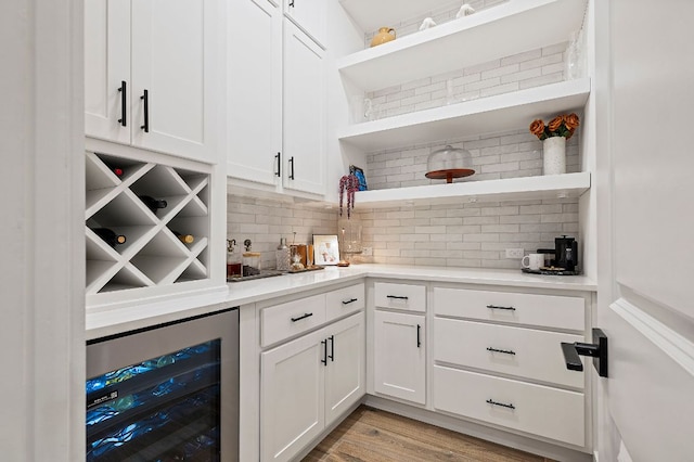 296 Running Bird Rd, Austin, TX 78737 - bar featuring wine cooler, tasteful backsplash, and light wood-style floors