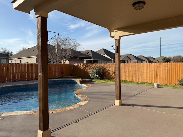 view of pool featuring a patio area, a fenced backyard, and a fenced in pool