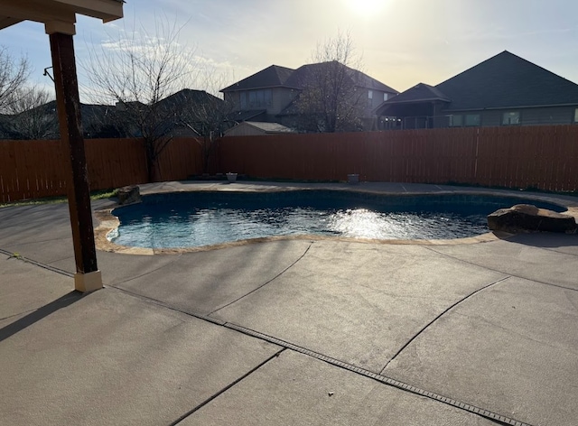 view of pool with a fenced in pool, a patio area, and a fenced backyard