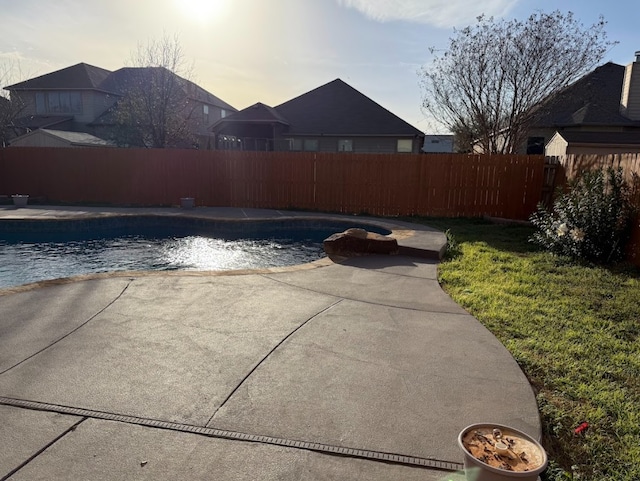 view of pool featuring a fenced in pool, a fenced backyard, and a patio