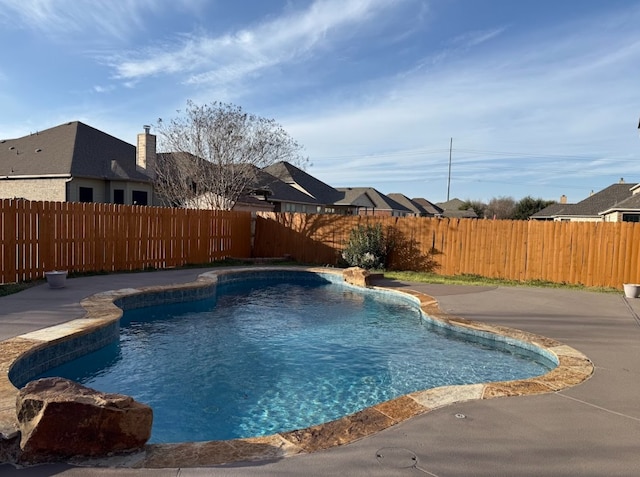 view of swimming pool featuring a fenced in pool, a patio area, and a fenced backyard