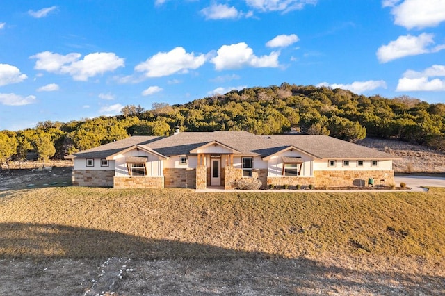 2807 Grimes Crossing Rd, Copperas Cove, TX 76522 - ranch-style home featuring stone siding and a forest view