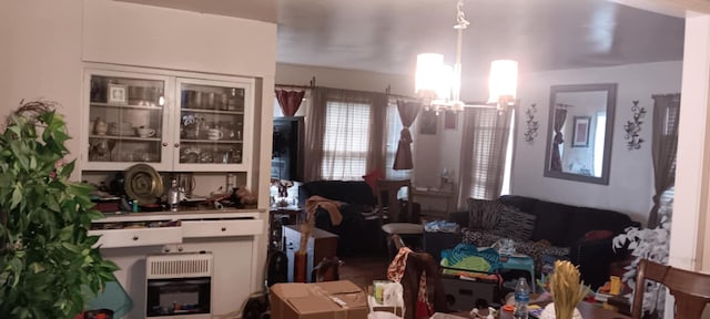 dining area with a chandelier and heating unit