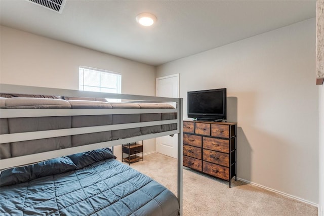 bedroom featuring carpet floors, baseboards, and visible vents