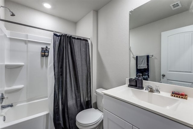 full bathroom with visible vents, vanity, toilet, and shower / bath combo with shower curtain