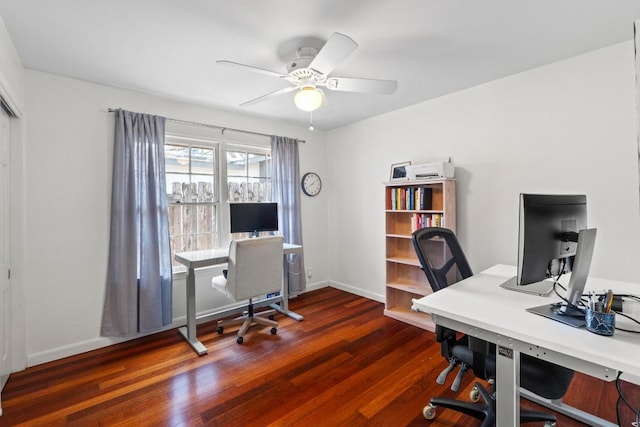 office area with ceiling fan, baseboards, and dark wood-style flooring