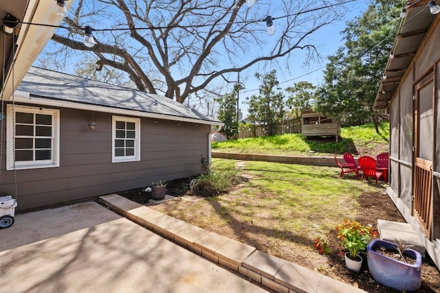 view of yard with a patio and fence