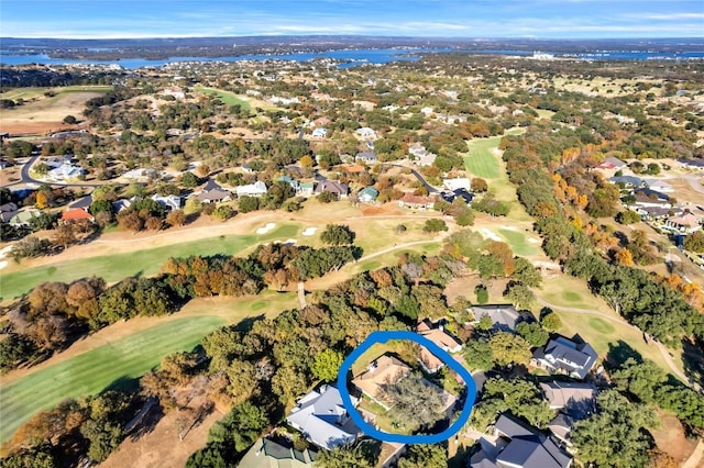 birds eye view of property with golf course view