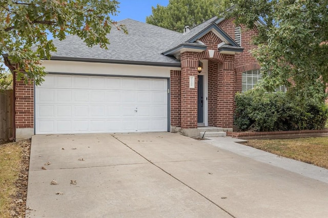 view of front facade featuring brick siding, driveway, an attached garage, and roof with shingles